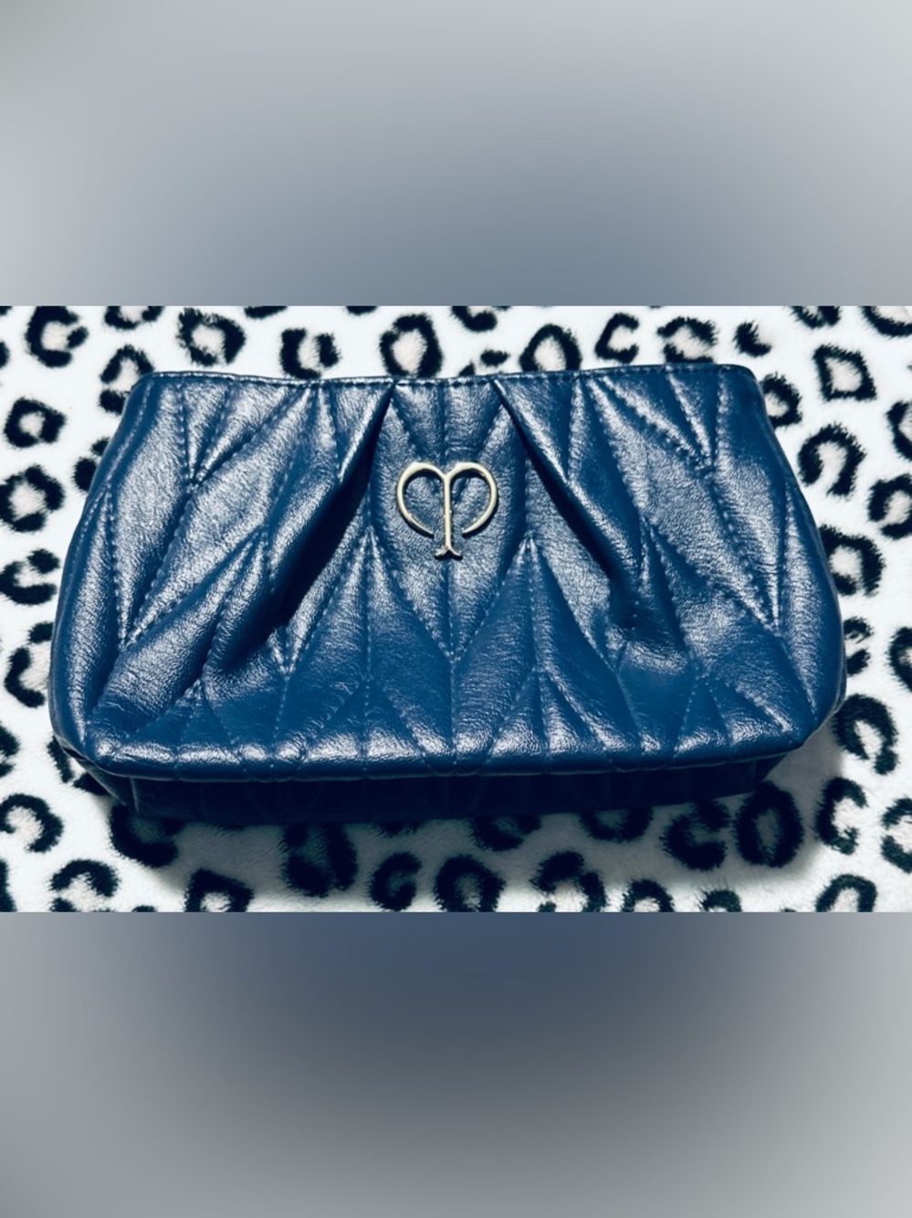NWOT Cle De Peau Navy Quilted Luxury Cosmetic Pouch with Gold Logo